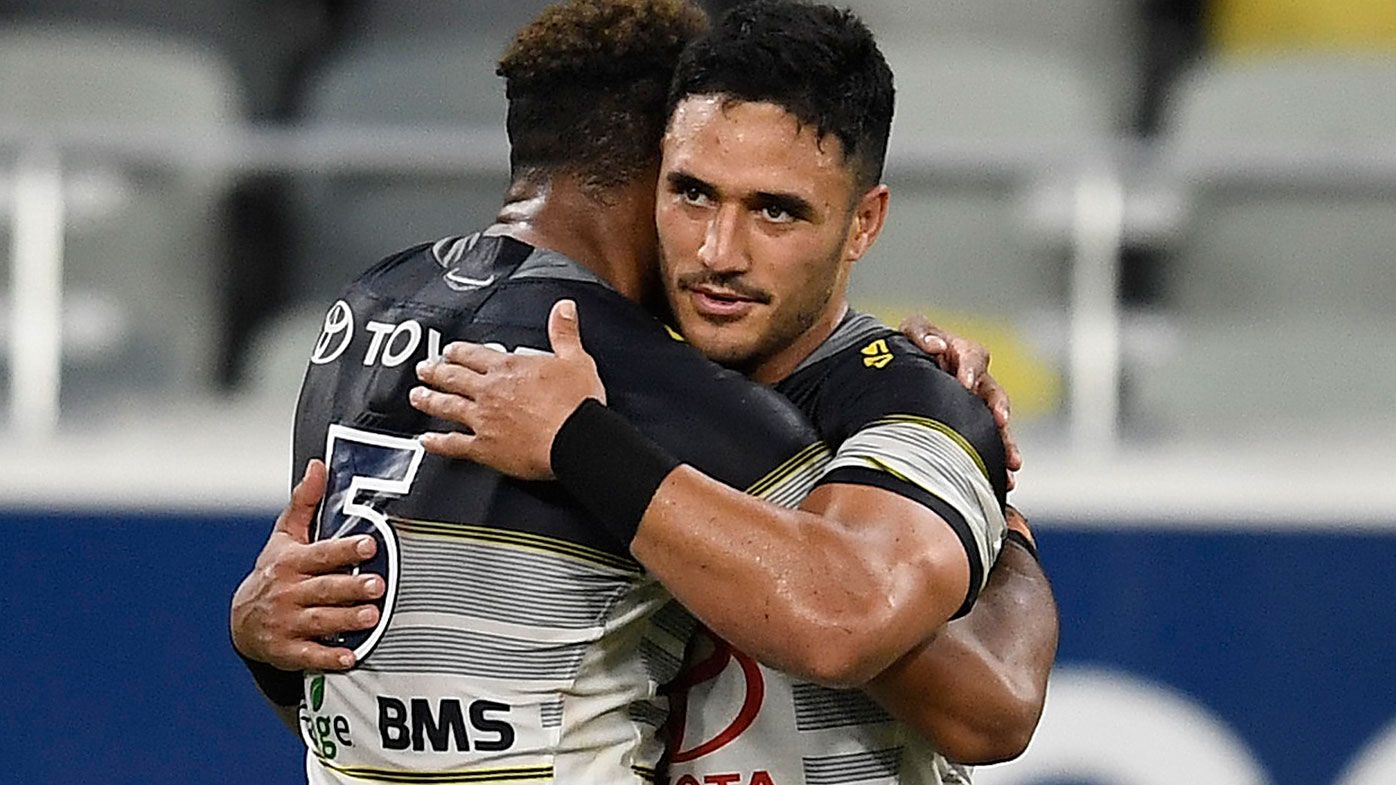 Hamiso Tabuai-Fidow and Valentine Holmes of the Cowboys embrace after winning the round 17 NRL match between the North Queensland Cowboys and the St George Illawarra Dragon