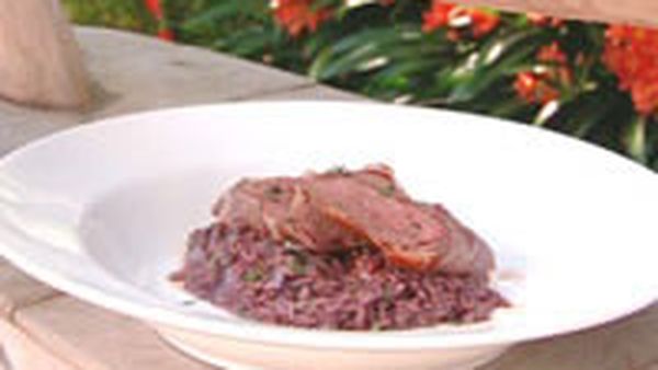 Raddiccio and red wine risotto with lamb loins in prosciutto