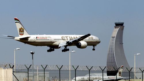 An Etihad Airways plane prepares to land at the Abu Dhabi airport in the United Arab Emirates.