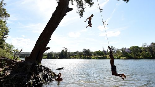 Children cool off in the Nepean River at Penrith.