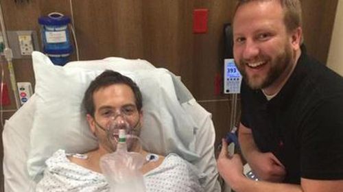 Ryan Roche in hospital with a friend. (Supplied)