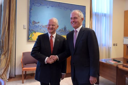 Phillip Ruddock (left) shakes hands with Prime Minister Malcolm Turnbull at parliament last year. (AAP)