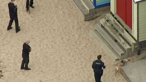 Victoria Police search the area around a beach box on the Mornington Peninsula.