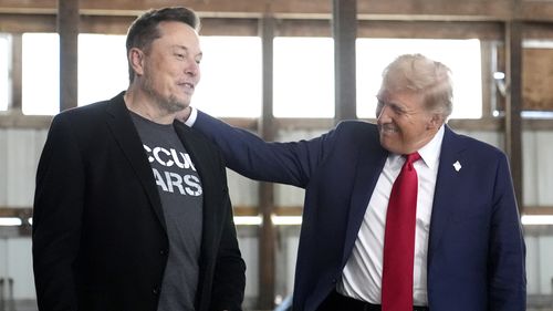 FILE - Tesla and SpaceX CEO Elon Musk, left, and Republican presidential nominee former President Donald Trump attend a campaign event at the Butler Farm Show on Oct. 5, 2024, in Butler, Pa. (AP Photo/Alex Brandon, File)