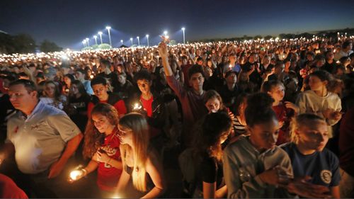 Hundreds gather for a memorial for the students killed in the Florida gunman's rampage. (AAP)