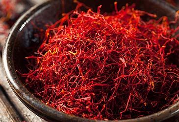 The stigmas of which plant are harvested to produce saffron?