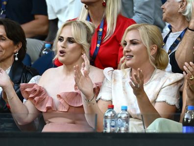 MELBOURNE, AUSTRALIA - JANUARY 12: Rebel Wilson and wife Ramona Agruma watch the Women's Singles First Round match between Aryna Sabalenka and Sloane Stephens of the United States during day one of the 2025 Australian Open at Melbourne Park on January 12, 2025 in Melbourne, Australia. (Photo by Quinn Rooney/Getty Images)
