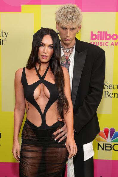 Machine Gun Kelly and Meghan Fox poses backstage for the 2021 Billboard Music Awards, broadcast on May 23, 2021 at Microsoft Theater in Los Angeles, California. 