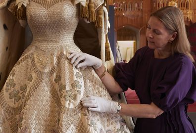 The Coronation Dress and Robe of Estate go on display inside St George's Hall in Windsor Castle