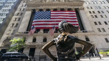 The &quot;Fearless Girl&quot; bronze sculpture looks towards the New York Stock Exchange (Photo: September 22, 2020)