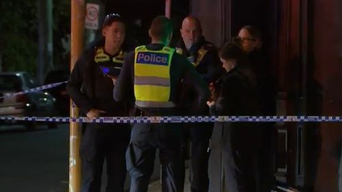 Police set up a crime scene at the site of a stabbing in Melbourne.