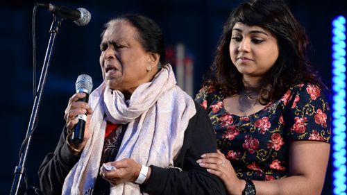 Edith Visvanathan, (left), the grandmother of Myuran Sukumaran, speaks at a candlelight vigil in Sydney's Martin Place. (AAP)