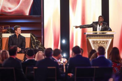 Tom Brady and Kevin Hart speak onstage during G.R.O.A.T The Greatest Roast Of All Time: Tom Brady for the Netflix is a Joke Festival at The Kia Forum on May 05, 2024 in Inglewood, California.  