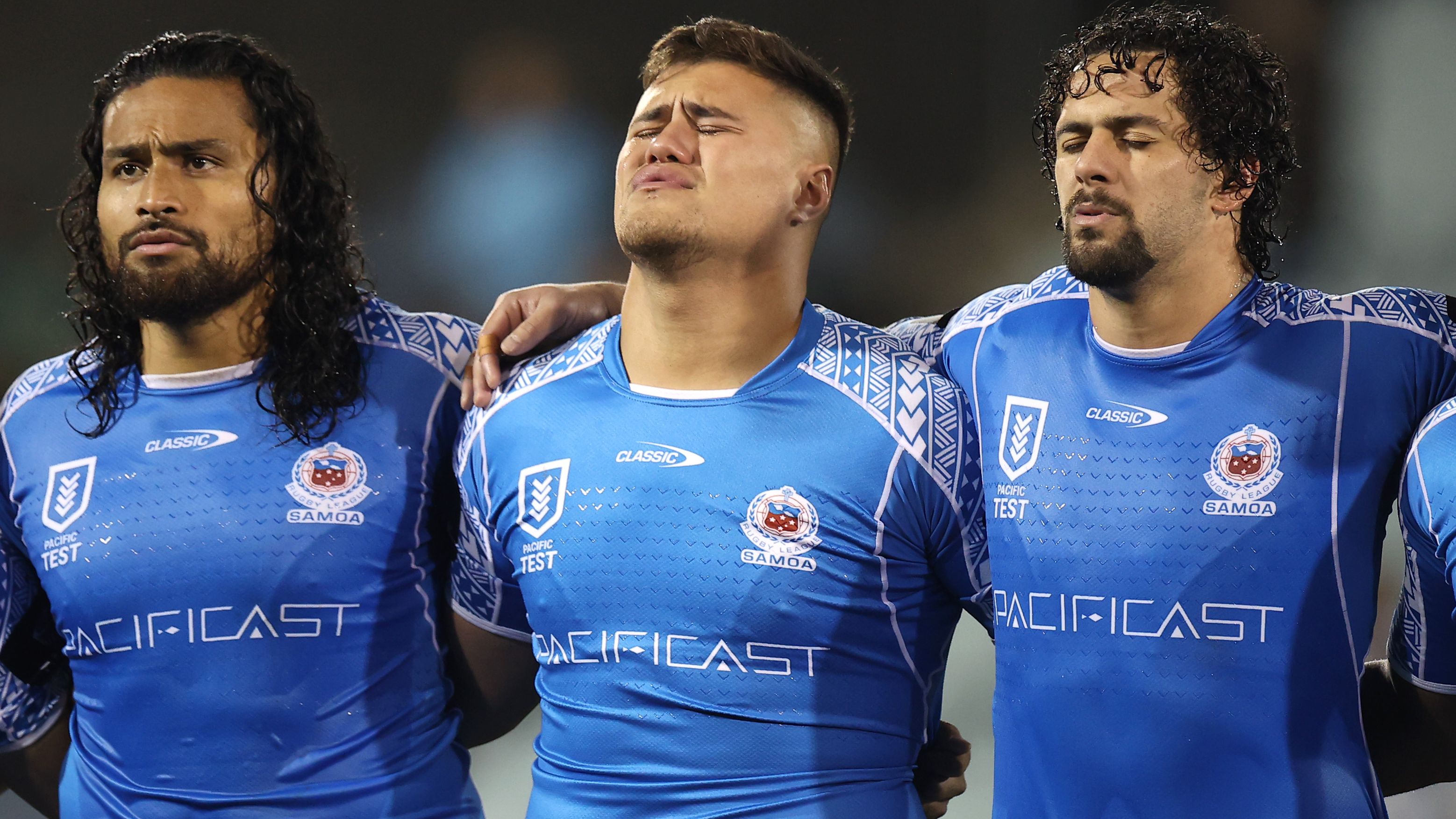 Bunty Afoa, Josh Schuster and Josh Aloiai of Samoa sing the national anthem ahead of the Test match between Samoa and the Cook Islands at Campbelltown Sports Stadium.