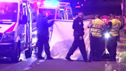 The woman was hit by a small black truck in Villawood in Sydney's west at 9.35pm. (9NEWS)