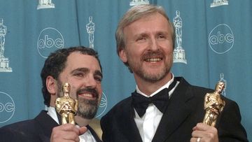 FILE - James Cameron, right, and Jon Landau hold the Oscars for Best Picture for the film &quot;Titanic&quot; at the 70th annual Academy Awards at the Shrine Auditorium in Los Angeles, March 23, 1998. Landau, an Oscar-winning producer who worked closely with director Cameron on Titanic&quot; and the Avatar series, has died, announced in a statement Saturday, July 6, 2024. (AP Photo/Reed Saxon, File)