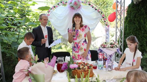 In this photo provided by Tetiana Boikiv, she, centre, and Mykola "Kolia" Moroz celebrate their wedding in Ozera, Ukraine on Aug. 16, 2020.