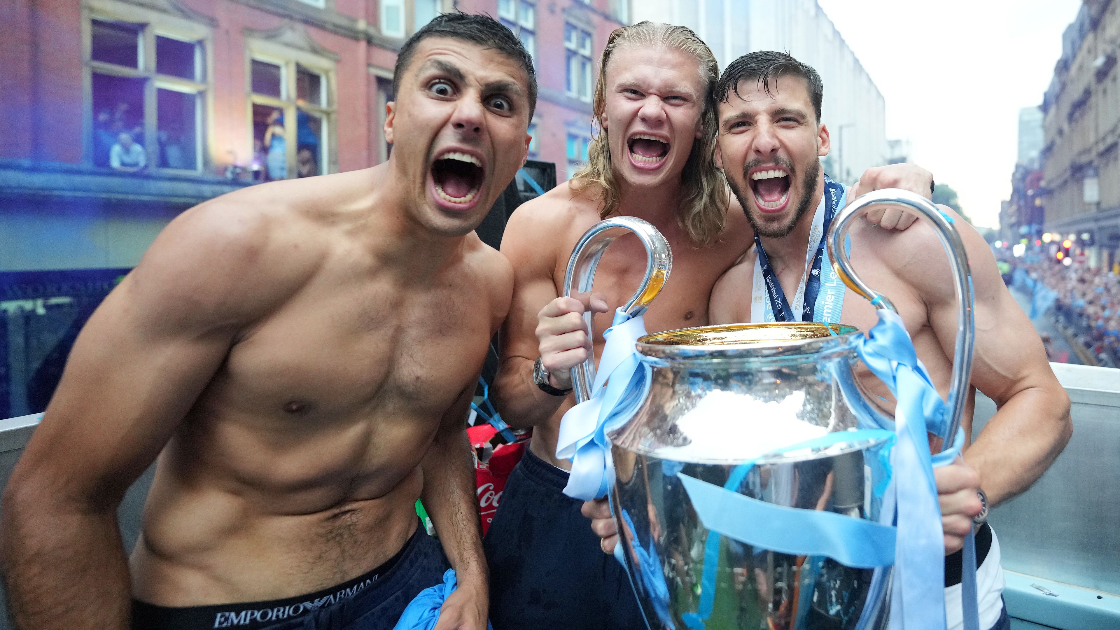 Rodri celebrates with Erling Haaland and Ruben Dias of Manchester City.