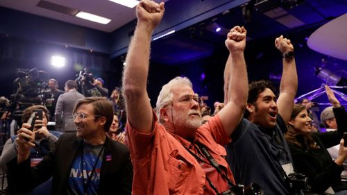 Celebration as the InSight lander touchdowns on Mars at NASA's Jet Propulsion Laboratory. 