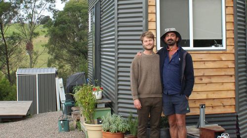 Josh Heins and Manu Bohn built their tiny house on wheels to escape the housing crisis in Bega Valley.