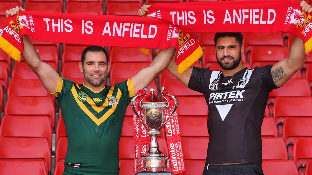 Cameron Smith and Jesse Bromwich stand in the iconic Kop stand. (Getty) 