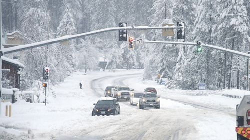 The snow was so thick that a vehicle got stuck in it in Grass Valley in California. 