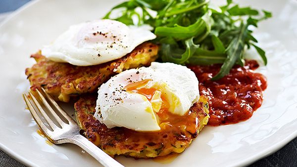 Cheesy corn and zucchini fritters, poached eggs and tomato relish