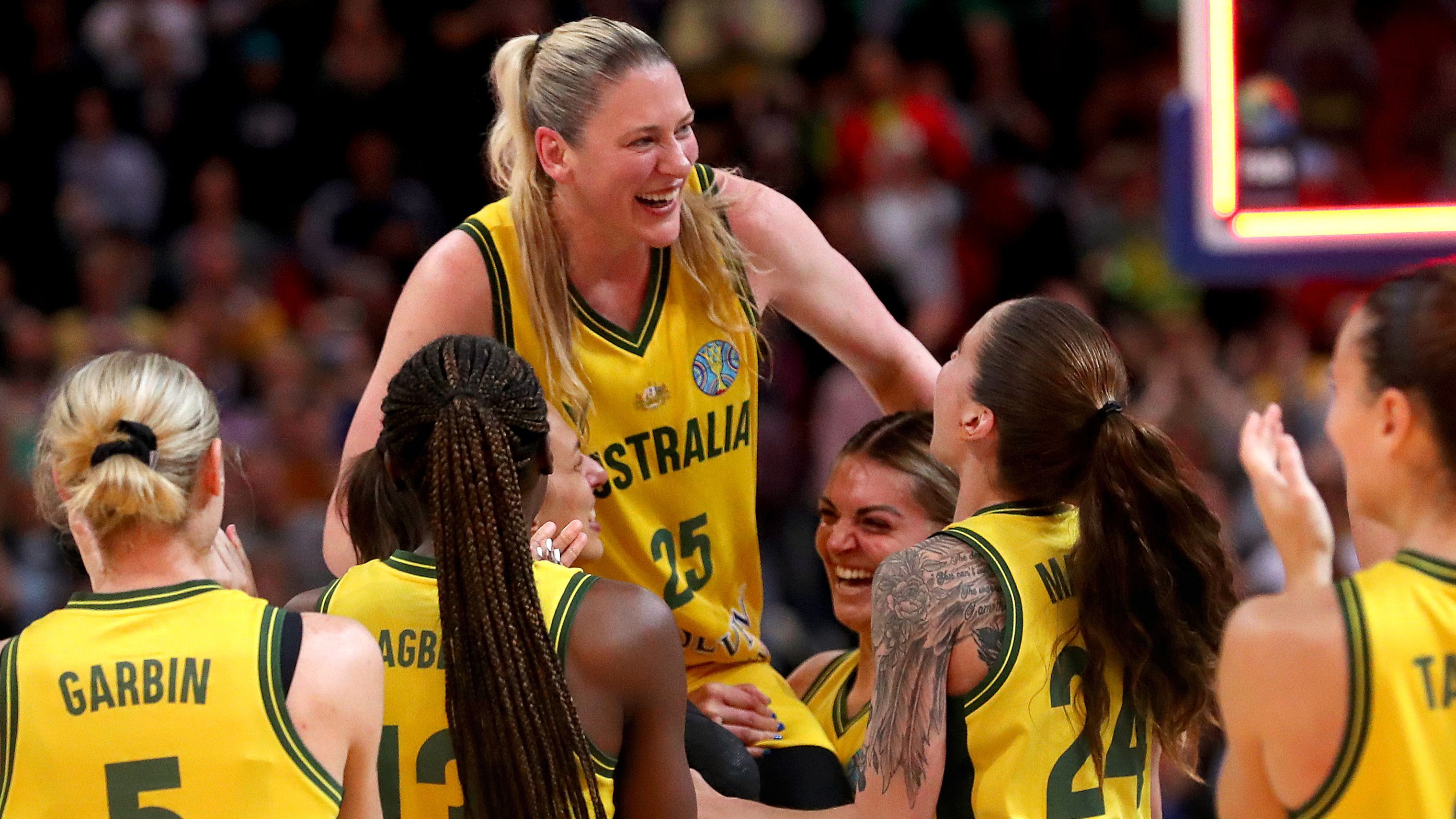 Lauren Jackson celebrates with teammates after playing her final game for the Opals.