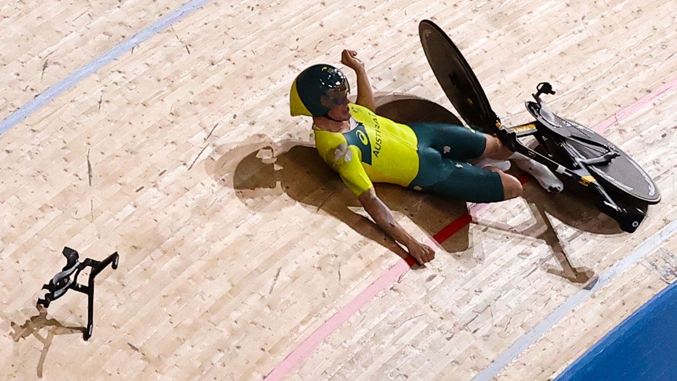 Alexander Porter falls during the men&#x27;s team pursuit qualifying cycling track event.