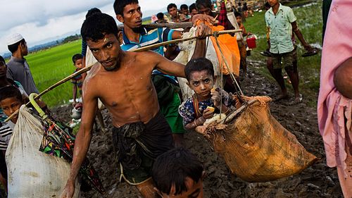 Some 60,000 refugees, mostly Rohingya, have poured into neighbouring Bangladesh since the latest round of fighting broke out nine days ago when Rohingya militants attacked security installations. (AAP)