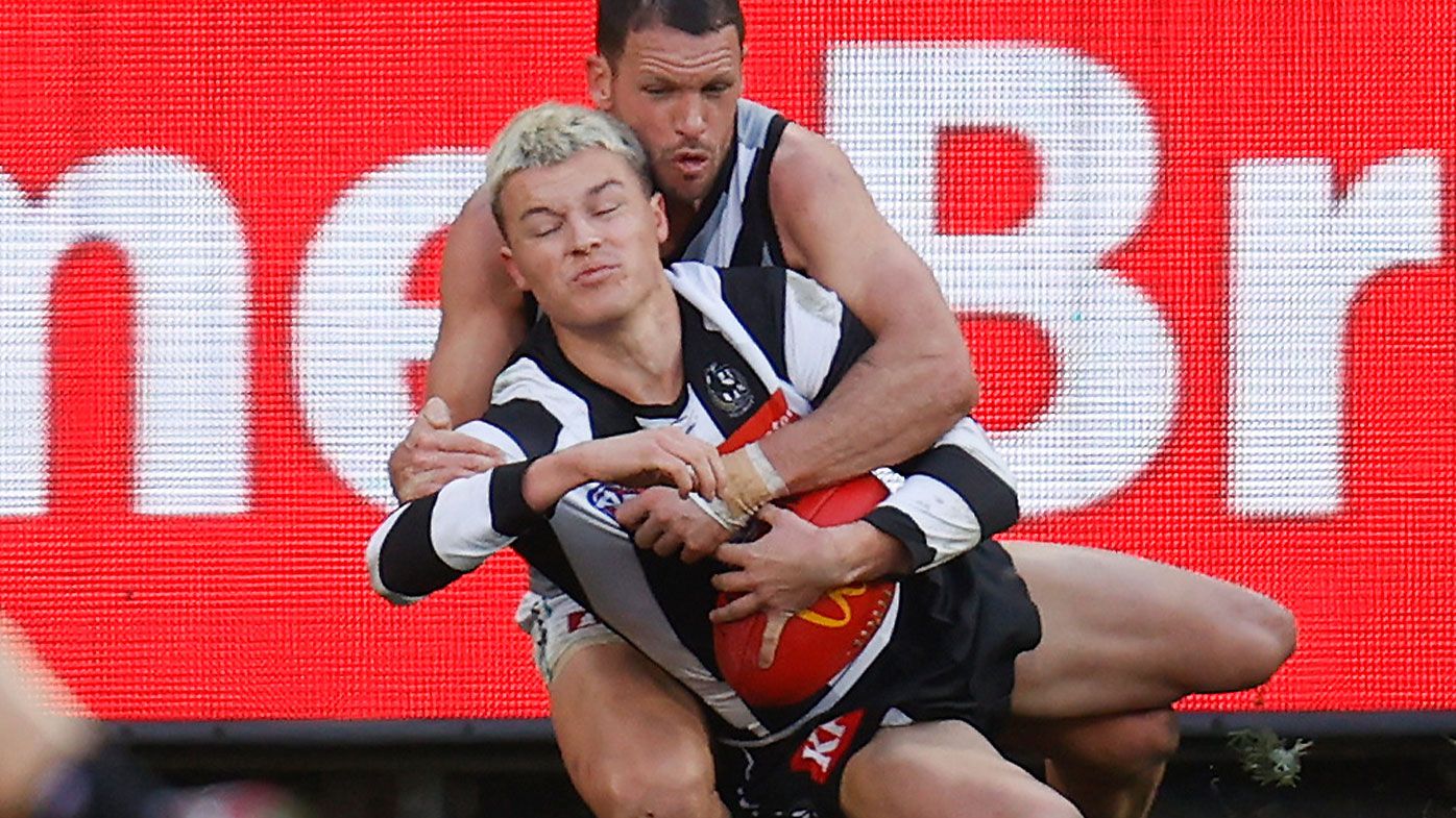 Collingwood youngster Jack Ginnivan tackled by Port Adelaide&#x27;s Travis Boak