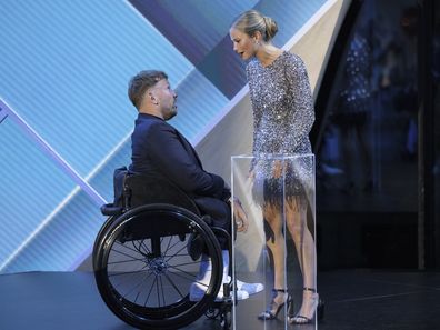 CANBERRA, AUSTRALIA - JANUARY 25: Australian of the year Dylan Alcott greets Grace Tame at the 2022 Australian of the Year Awards at the National Arboretum on January 25, 2022 in Canberra, Australia. The Australian of the Year is a national award given to an Australian citizen by the National Australia Day Council. (Photo by Brook Mitchell/Getty Images)