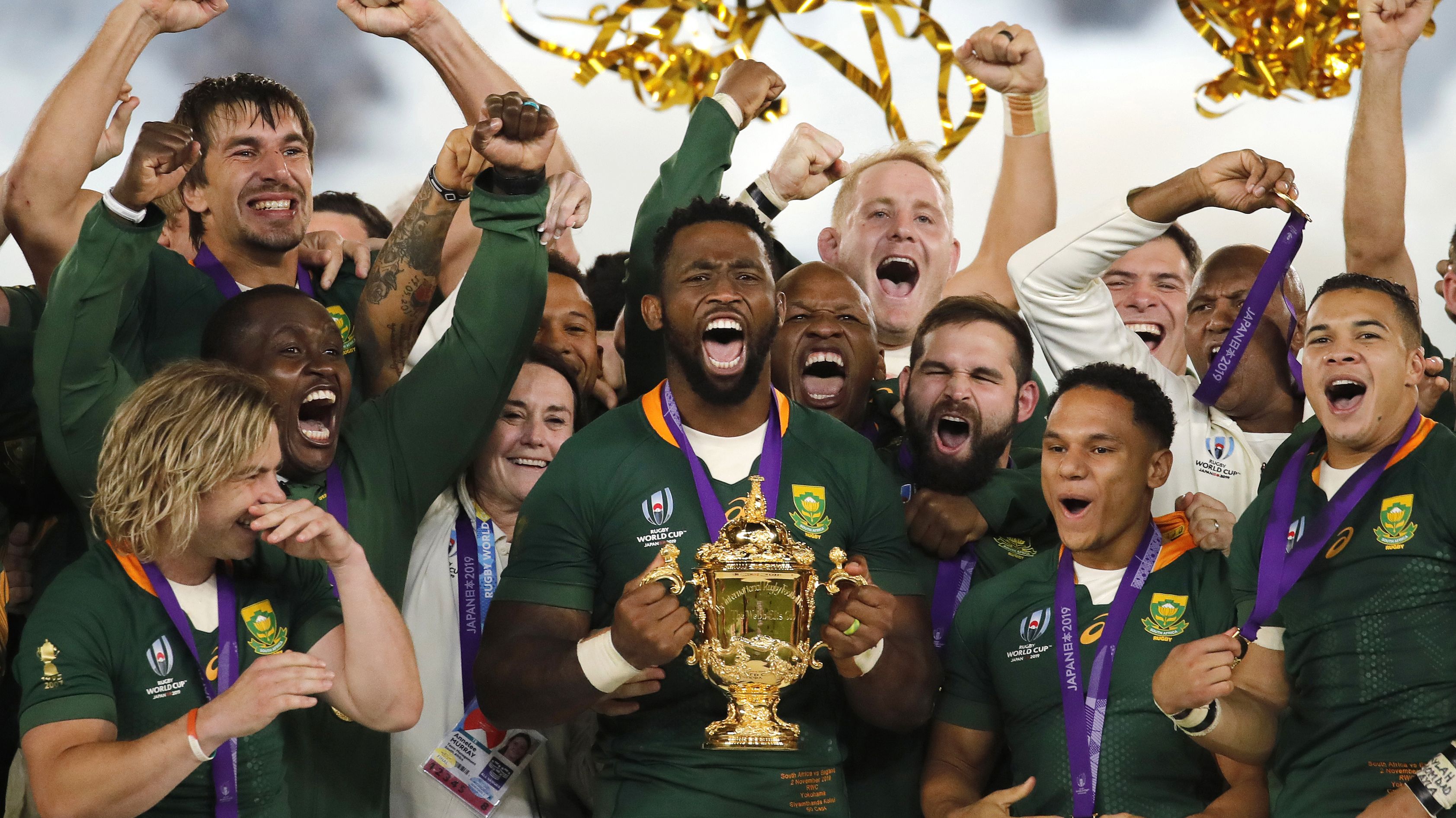 South African captain Siya Kolisi holds the Webb Ellis Cup aloft after South Africa defeated England to win the Rugby World Cup final.