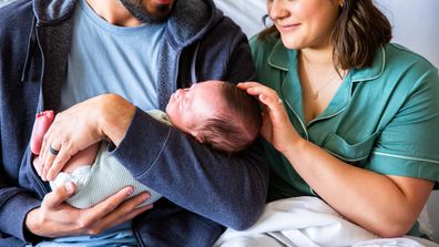 A young mum and dad with their newborn baby boy in the hospital