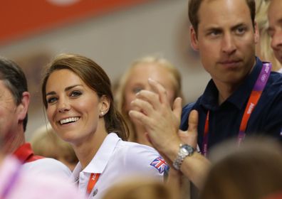 Prince William and Catherine Middleton watch the mens and womens sprinting at the London Olympics.