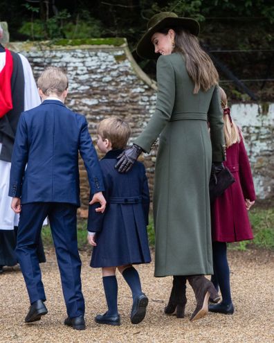 SANDRINGHAM, NORFOLK - DECEMBER 25:  Prince George,  Prince Louis and Catherine, Princess of Wales attend the Christmas Day service at Sandringham Church on December 25, 2022 in Sandringham, Norfolk. King Charles III ascended to the throne on September 8, 2022, with his coronation set for May 6, 2023. (Photo by Samir Hussein/WireImage)