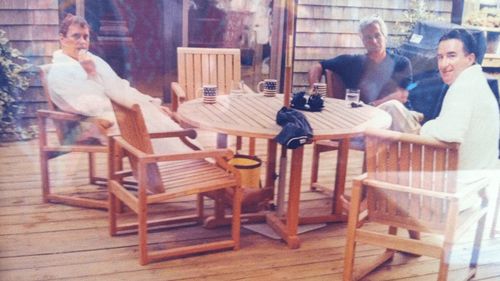 This undated photo released by the U.S. Department of Justice, shows Jeffrey Epstein, center, sitting with Andrew Mountbatten-Windsor and Peter Mandelson. (U.S. Department of Justice via AP)