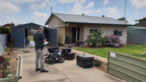 Police outside Colleen Adams' home in Maitland.