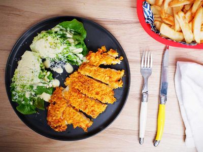 Dorito crumbed chicken schnitzel with cheat's Caesar salad
