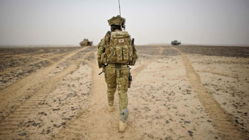 A British Army Officer walking towards British Army and Afghan National Civil Police (ANCOP) Observation Points in Helmand Province, Afghanistan. (Ben Birchall/PA Wire)