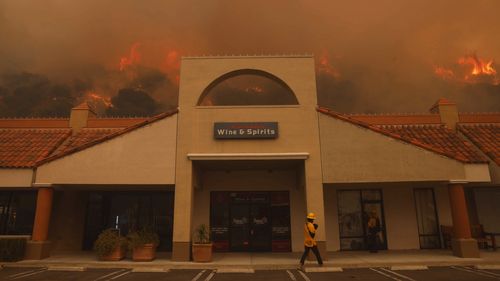 The Palisades Fire ignites behind a liquor store in the Pacific Palisades neighbourhood of Los Angeles.