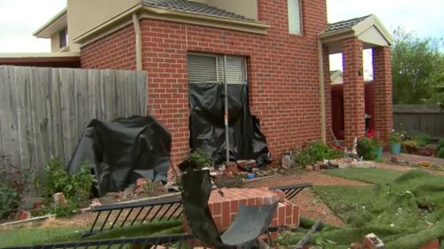 It is believed the driver lost control at a roundabout and ploughed into the residence. (9NEWS)