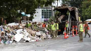ADF personnel clean up flood damage in Milton, Brisbane.