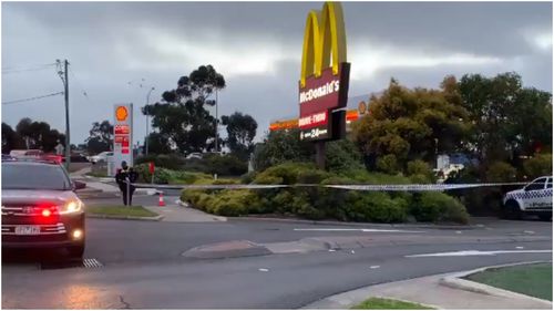 Police were forced to run and seek shelter in a McDonalds restaurant after their car was allegedly shot at and rammed this morning.