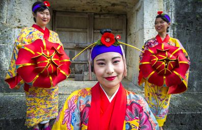 Women in traditional Okinawa dress.