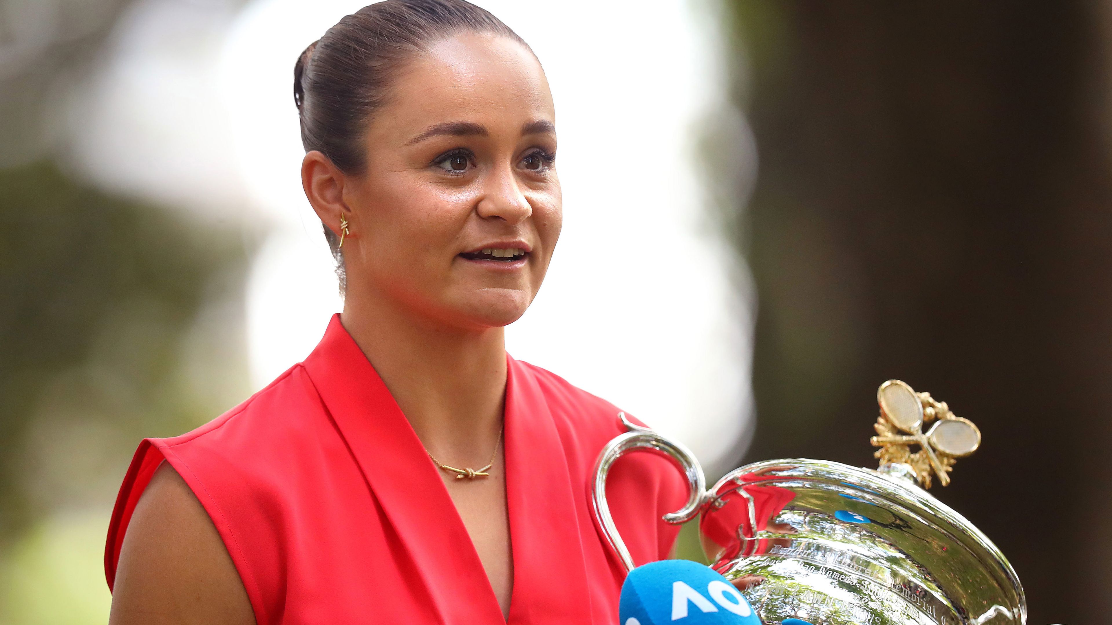 Ash Barty speaks to media with the Daphne Akhurst Memorial Cup after winning the 2022 Australian Open.