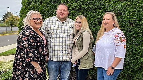 Jennifer Lannon, second from right, poses for a photo with her brother Chris Whitman, second from left, and sisters, Sarah Whitman, far left, and Kim Bermudez in Blackwood, New Jersey. Ms Lannon's body and three other people were found in a vehicle in a parking garage at Albuquerque International Sunport, New Mexico's largest airport, on March 5. Her ex-husband, Sean Lannon, said he confessed to 16 killings in all, including the four found at the airport.