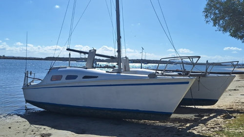 A search is underway for two men after their boat disappeared off the NSW coast on its way to Queensland. 
