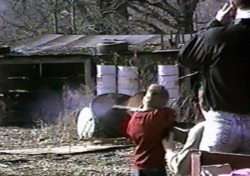 Andrew Golden is shown shooting a rifle at the age of six in this undated image from a home video.