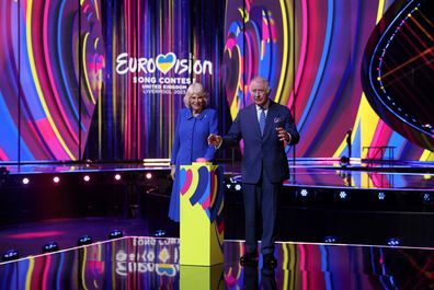 King Charles III and Camilla, Queen Consort react after switching on stage lighting as they visit the host venue of this year's Eurovision Song Contest, the M&S Bank Arena in Liverpool on April 26, 2023 in Liverpool 